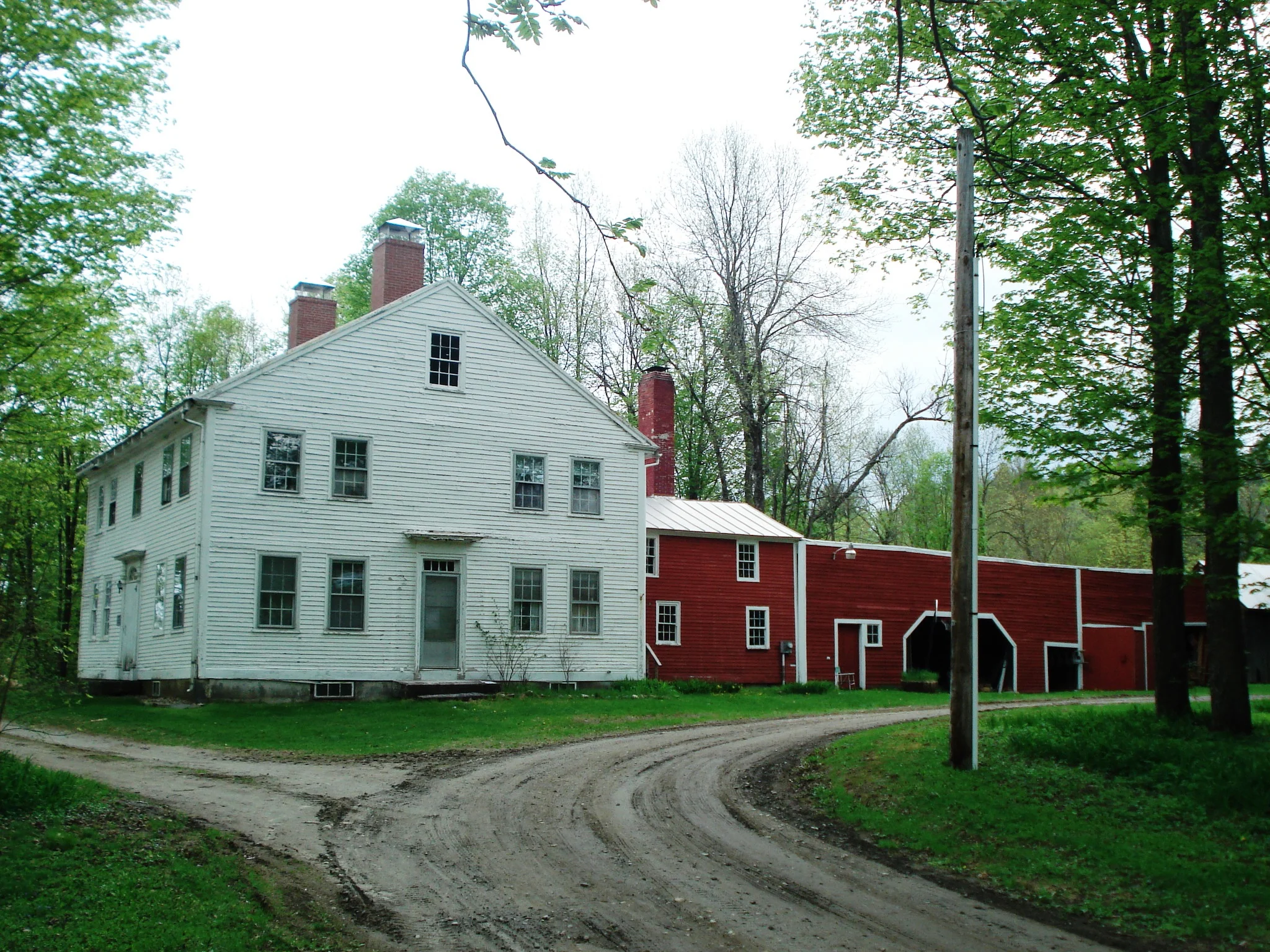 Exterior with Ell and sheds.JPG