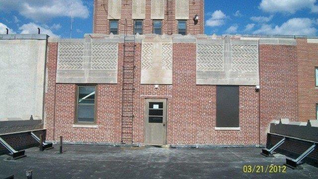 Existing tower before renovation, showing steel bracing of parapet.jpg