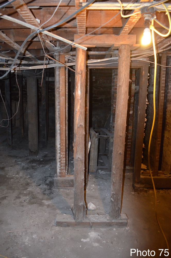12 Existing improvised support beams in basement.png
