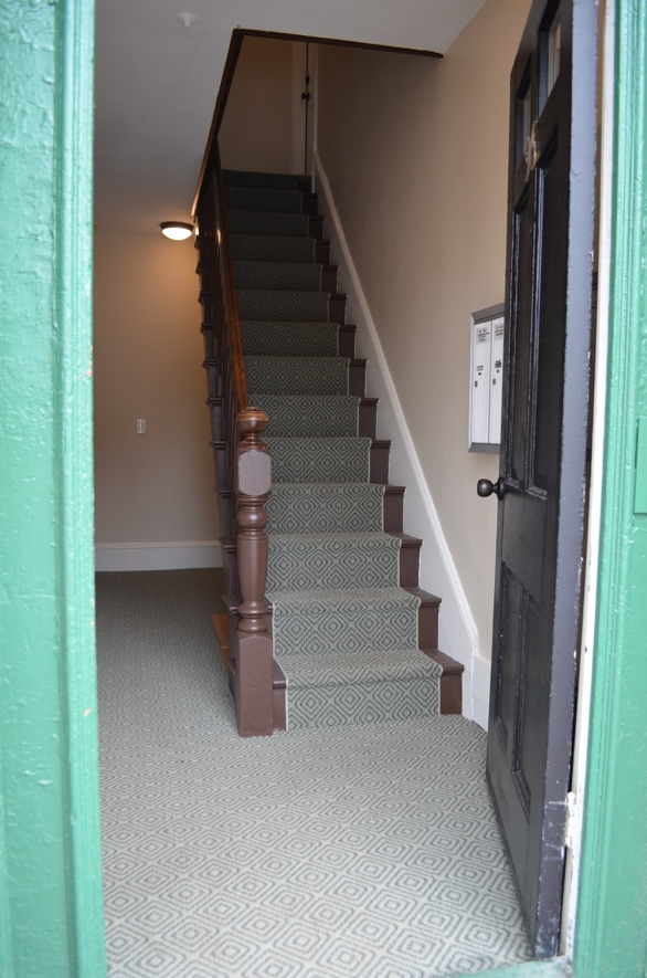 17 Front entryway and central staircase after.png