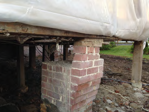 The original beam here may have been removed or damaged in a fire. The brick beam was removed and a new foundation and slab were installed in this area..png