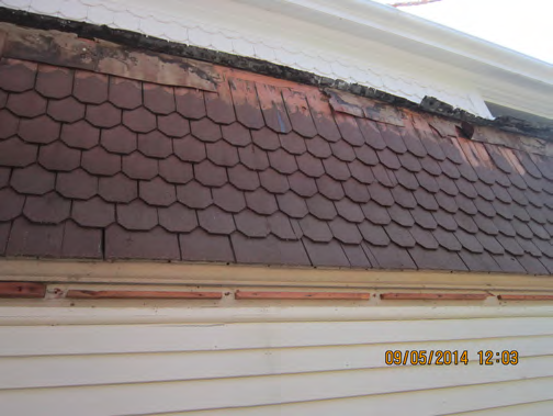 Restored cedar shingles emphasize another historic detail on the home..png