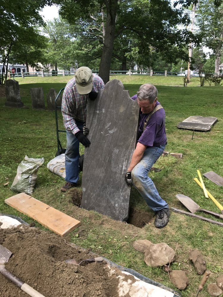 9- Churchyard - re-placing stones (1).jpeg