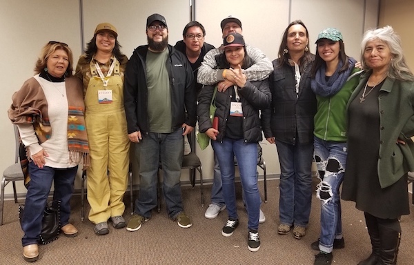 April 7, 2018—Winona LaDuke (third from the left) and Muriel YoungBear (center) gather with other indigenous hemp leaders for a picture at the NoCo Hemp Expo in Loveland, Colo. (Image: Sarah LittleRedfeather)