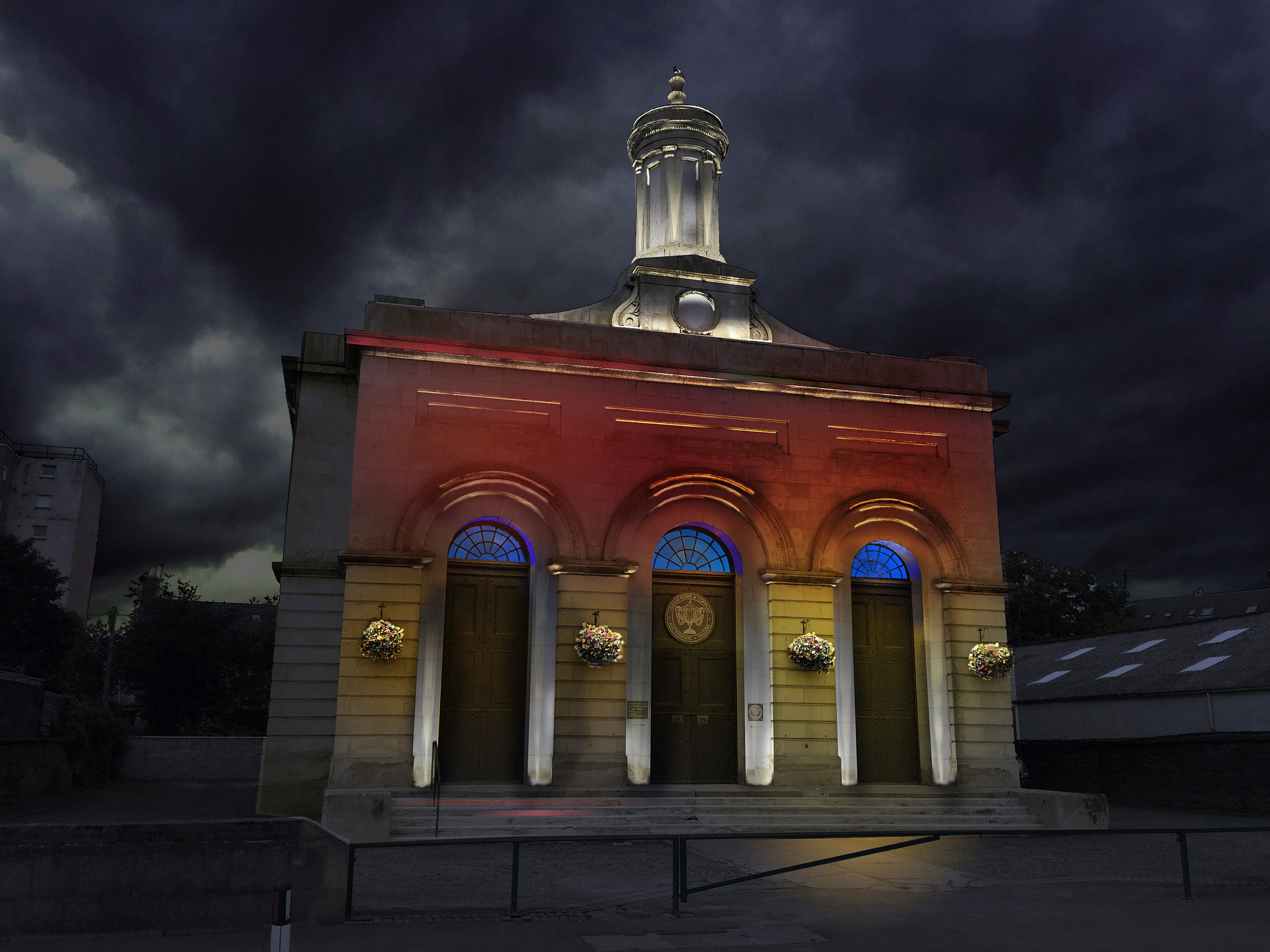 Elegant buildings such as Burns & Co make great candidates for lighting both architecturally and perhaps as a canvas for a projection based artwork as part of a lighting festival. In this example the focus should be in discreet uplighting at the foot of the pillars adjacent to the doors, catching all the architectural embellishments on the façade whilst also bringing attention to the ornamental tower on the roof. The illumination of Kinnoull Tower and it's cliffs provides a beacon high above the city, visible for miles from multiple approaches.