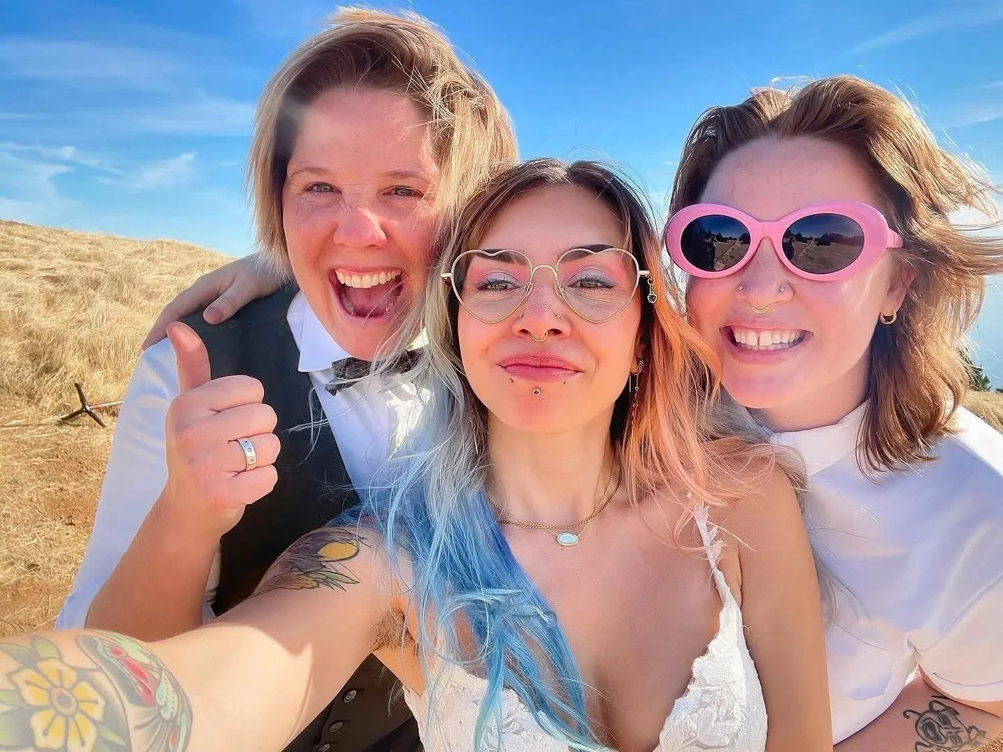 Lauren Snead celebrating with couple after officiating outdoor wedding