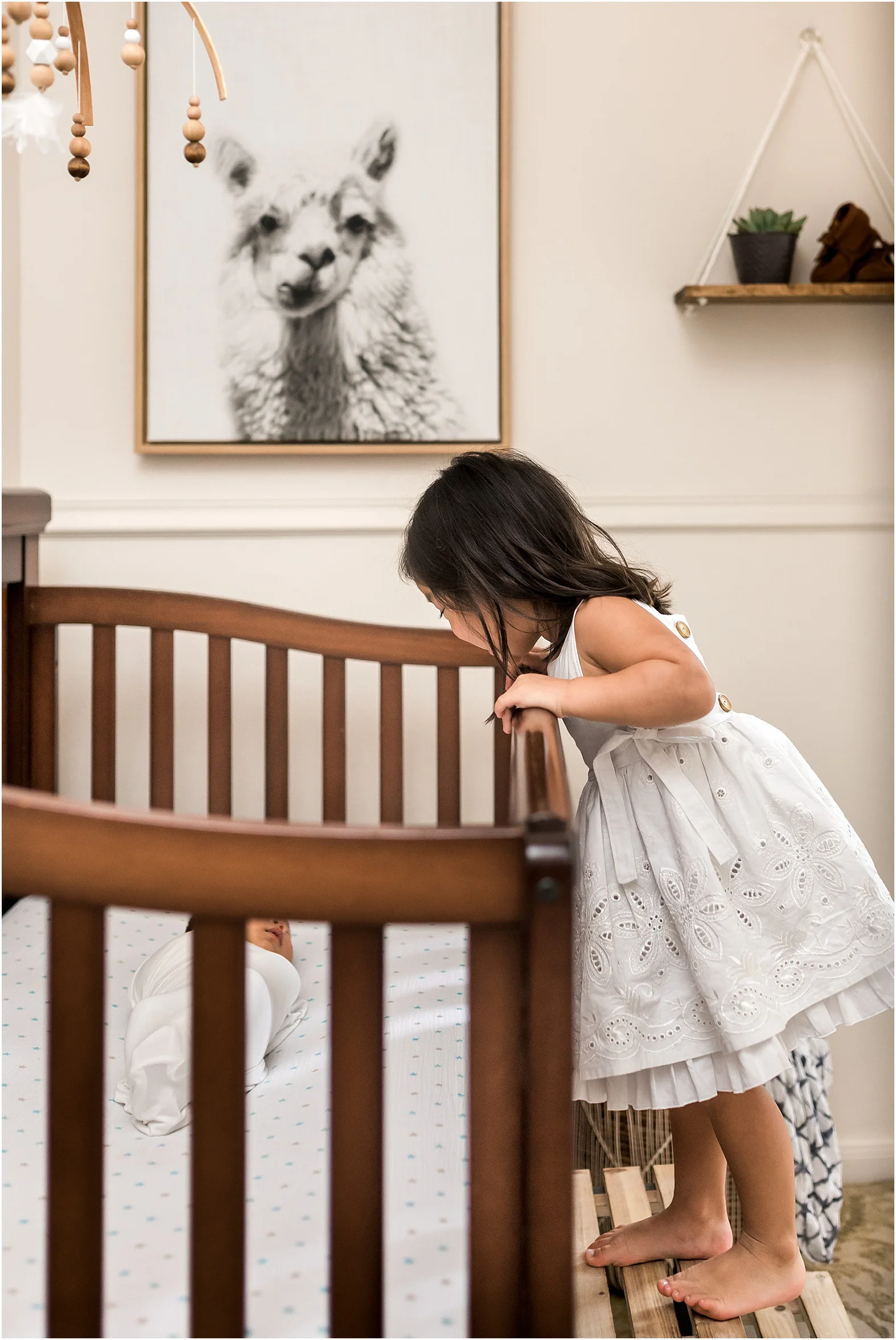 Sweet baby boy in home newborn session features minimal white details and all things modern. Family cuddles, big sister hugs, and all the mama love one can handle make for THE perfect moments. | Dear Marlowe Photography, Houston's Premier Luxury Newborn Lifestyle Photographer