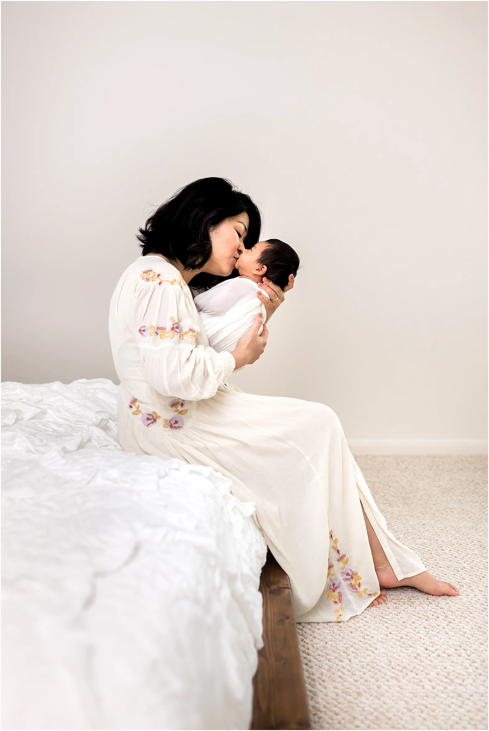 Sweet baby boy in home newborn session features minimal white details and all things modern. Family cuddles, big sister hugs, and all the mama love one can handle make for THE perfect moments. | Dear Marlowe Photography, Houston's Premier Luxury Newborn Lifestyle Photographer