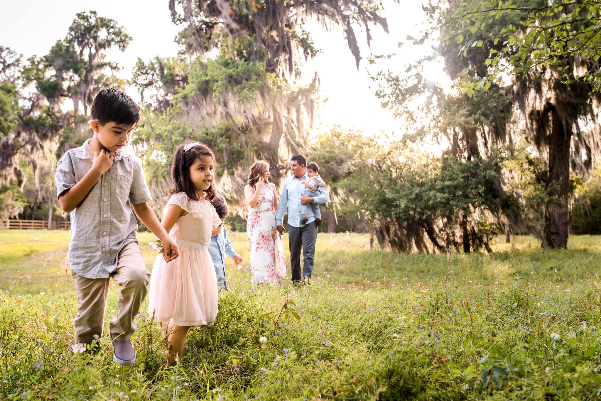 Outdoor Houston Family Photo Session with Golden Light, Mossy Trees, and Summer Sunlight.