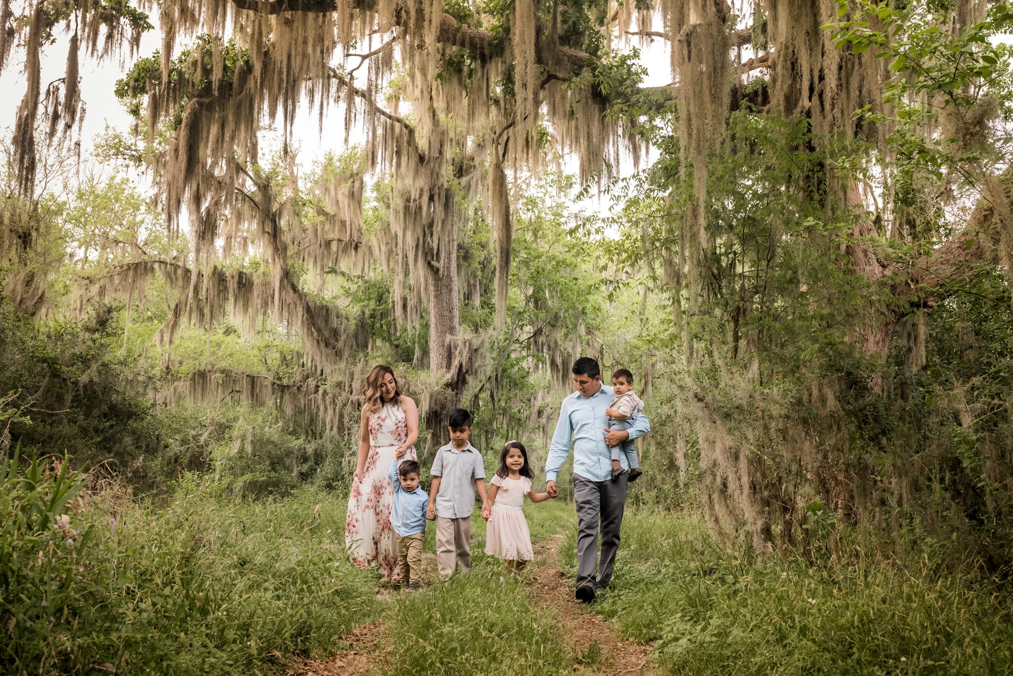 Outdoor Houston Family Photo Session with Golden Light, Mossy Trees, and Summer Sunlight.