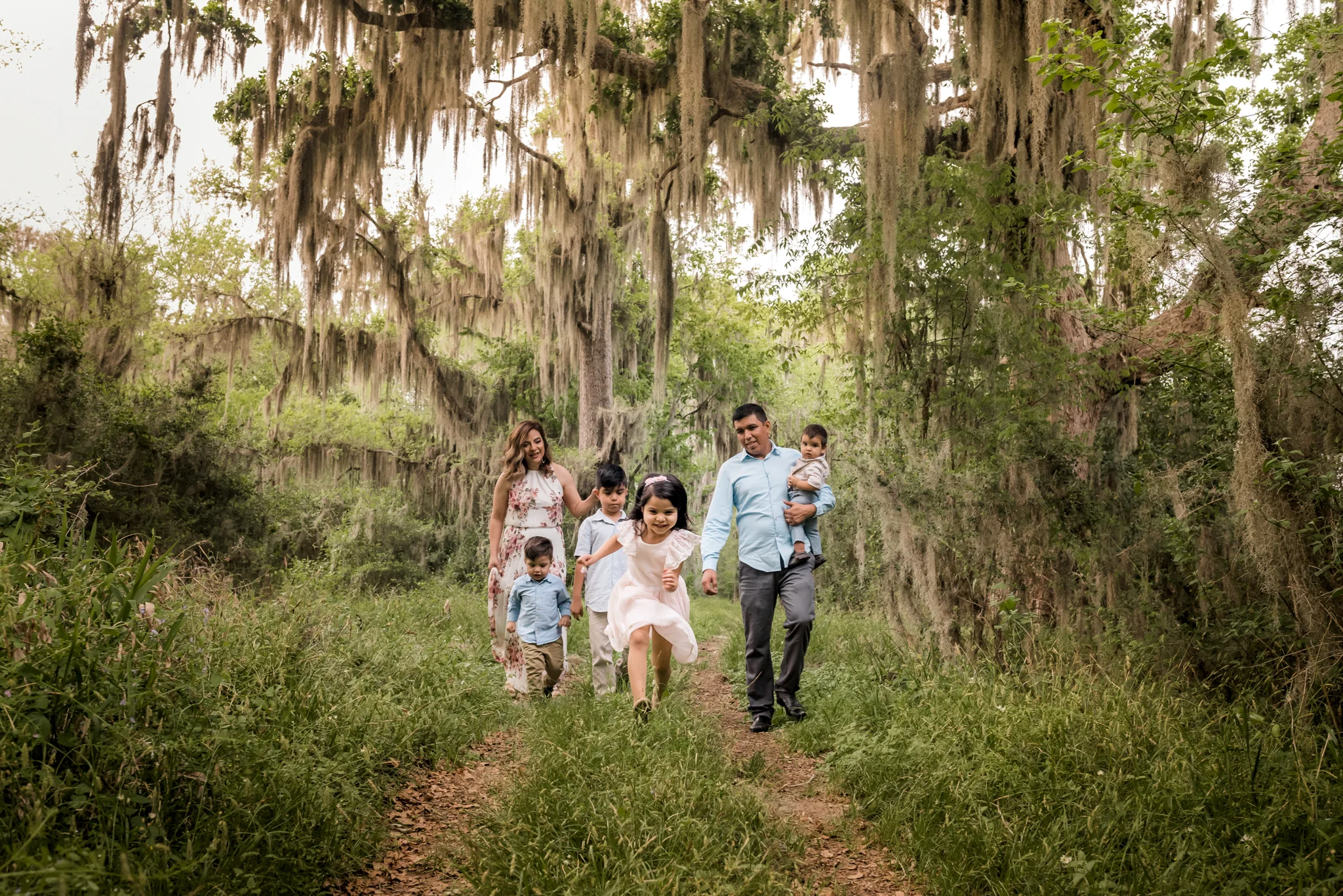 Outdoor Houston Family Photo Session with Golden Light, Mossy Trees, and Summer Sunlight.