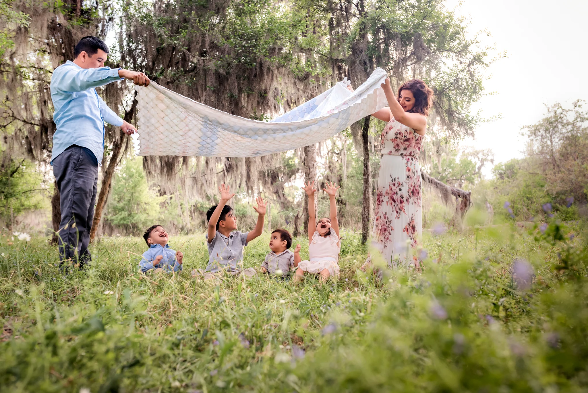 Outdoor Houston Family Photo Session with Golden Light, Mossy Trees, and Summer Sunlight.