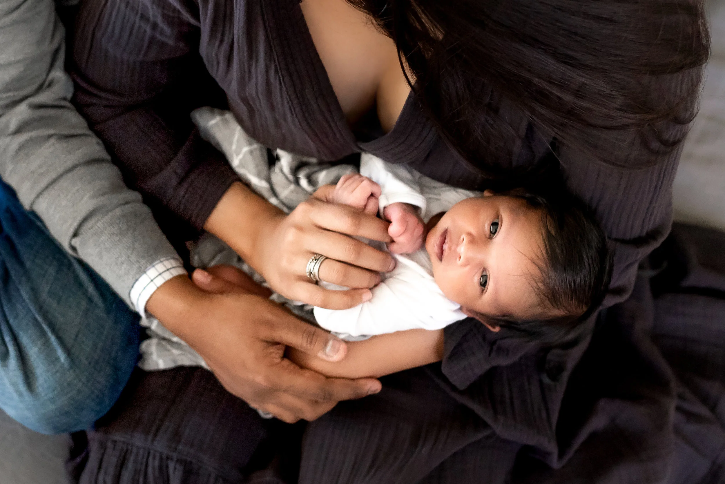 In home Houston Newborn Session with modern touches, boho accents, and vibrant colors.