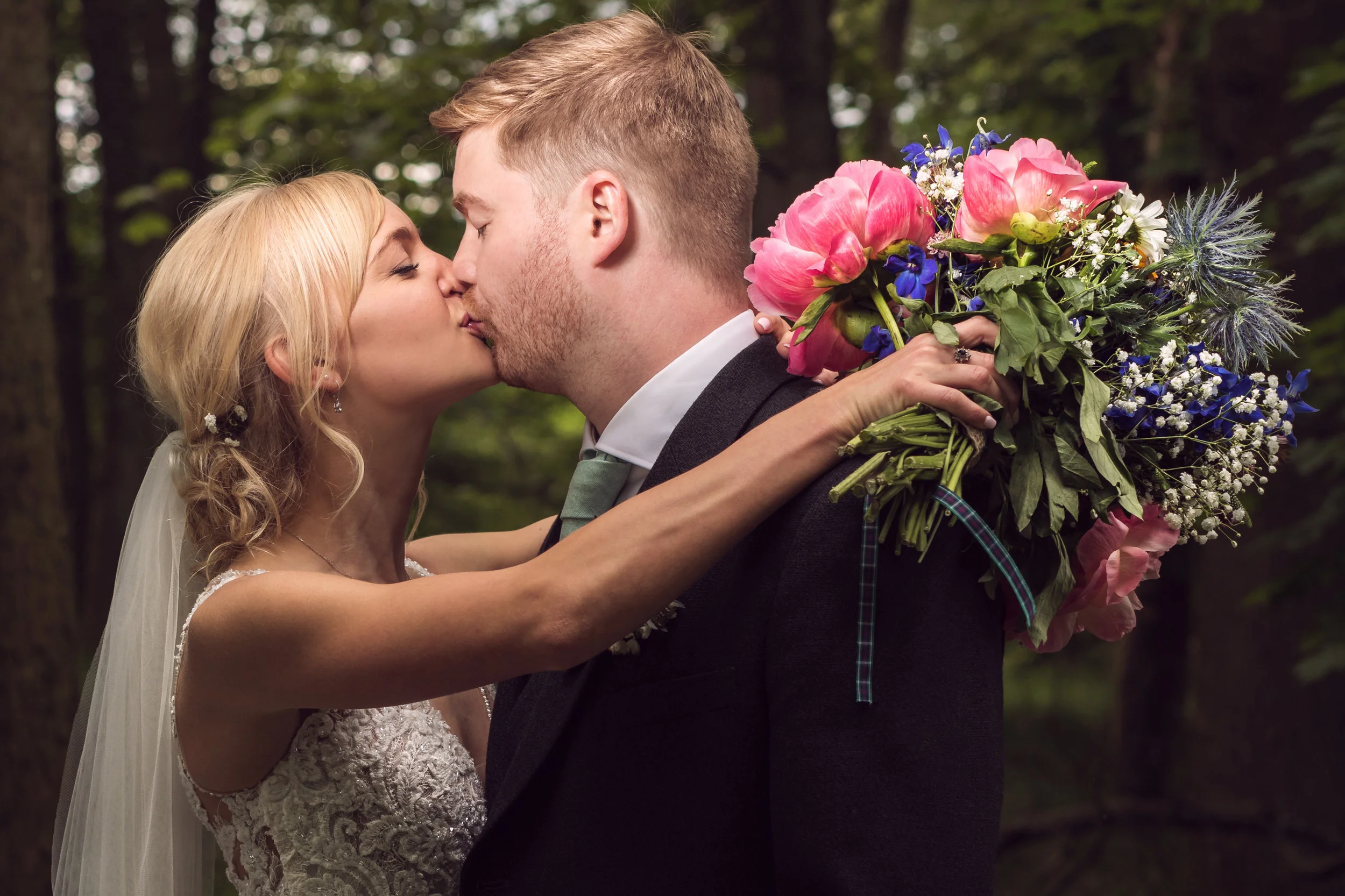 Beautiful bride and handsome groom. Wedding photographer based in Glasgow, Scotland. What a lovely wedding bouquet!