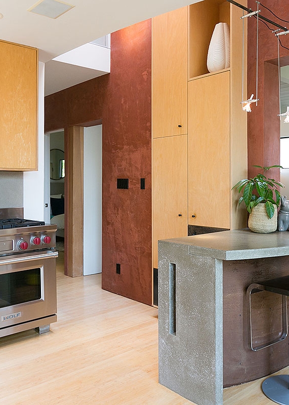 A FUNCTIONAL SKYLIGHT CAPS A CENTRAL LIGHT-WELL IN THE KITCHEN