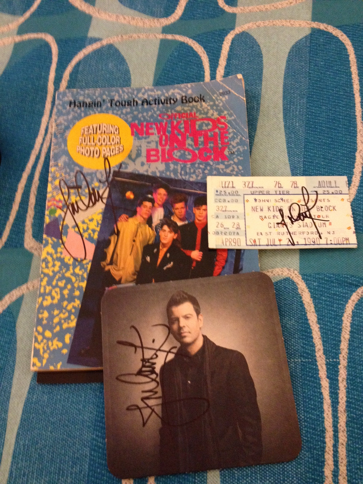 This photo has a few things I had signed by Jordan Knight during a hangout he had during the Nick & Knight tour a few years back. The hangout was a special meet and greet he did during the tour that included an individual photo with Jordan, opportunity to take selfies and get memorabilia signed, and some time to chat with him briefly as he went table to table to greet the fans. I had him sign an old NKOTB activity book, one of our tickets from the Magic Summer Tour I still had, and his coaster from the 10 Box Set.