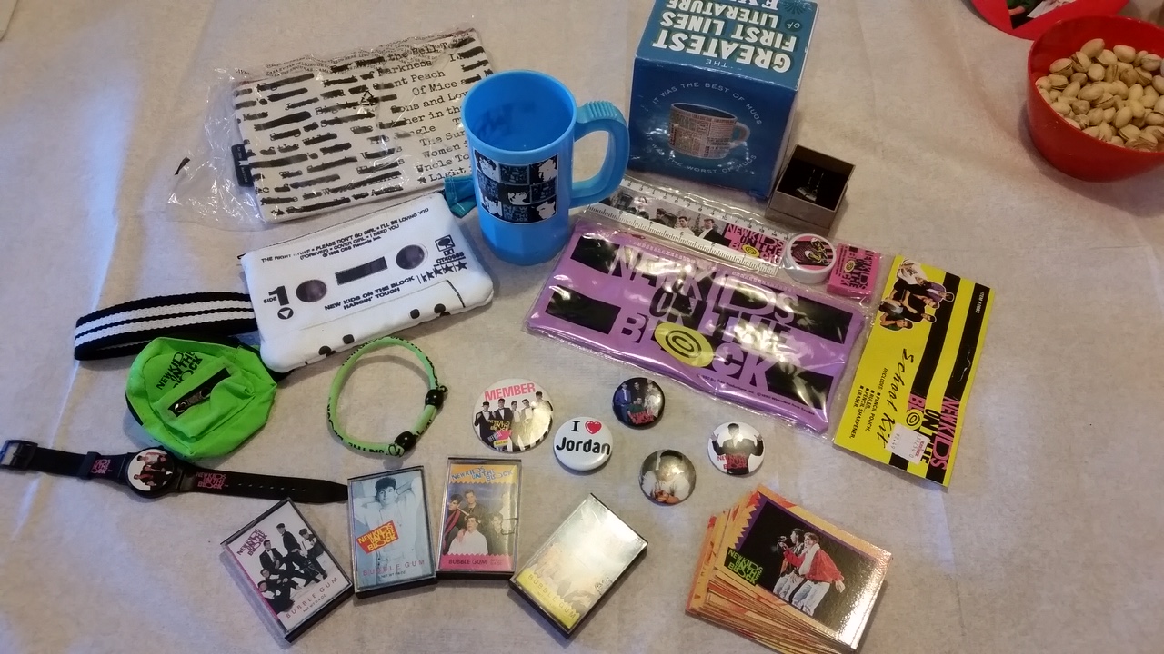 A collection of old school items my sister got me for my birthday a few years ago- trading cards, buttons, the bubble gum cassette tapes, watch, cup, and school set.