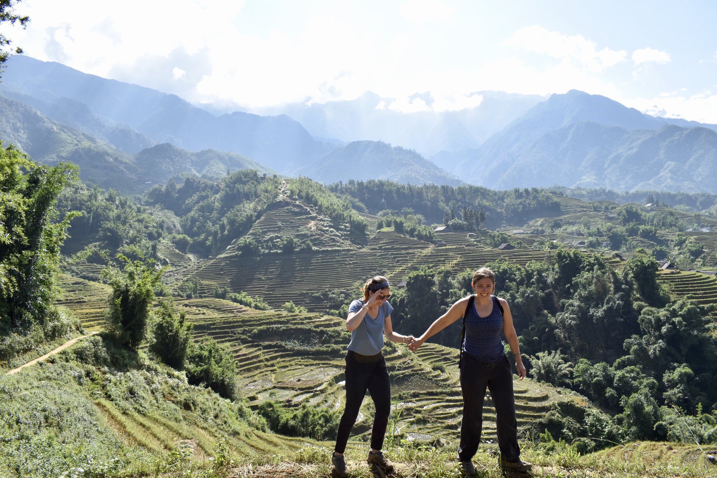  This particular rice paddy ridge was a little more dangerous than the others--it was on the side of the cliff. Louise helps a girl out.&nbsp;    