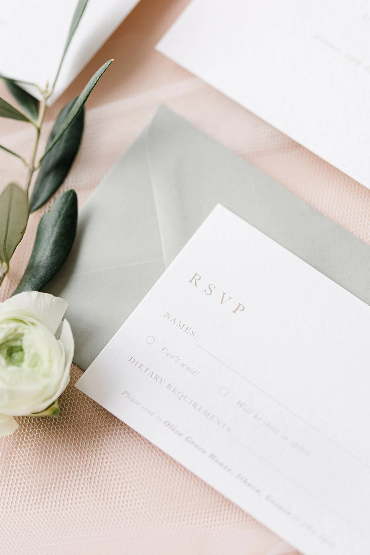 close up of A7 RSVP card with olive branch