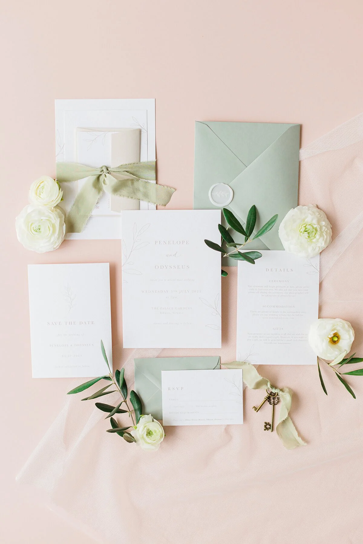 wedding stationery flat lay with minimal olive branch illustrations