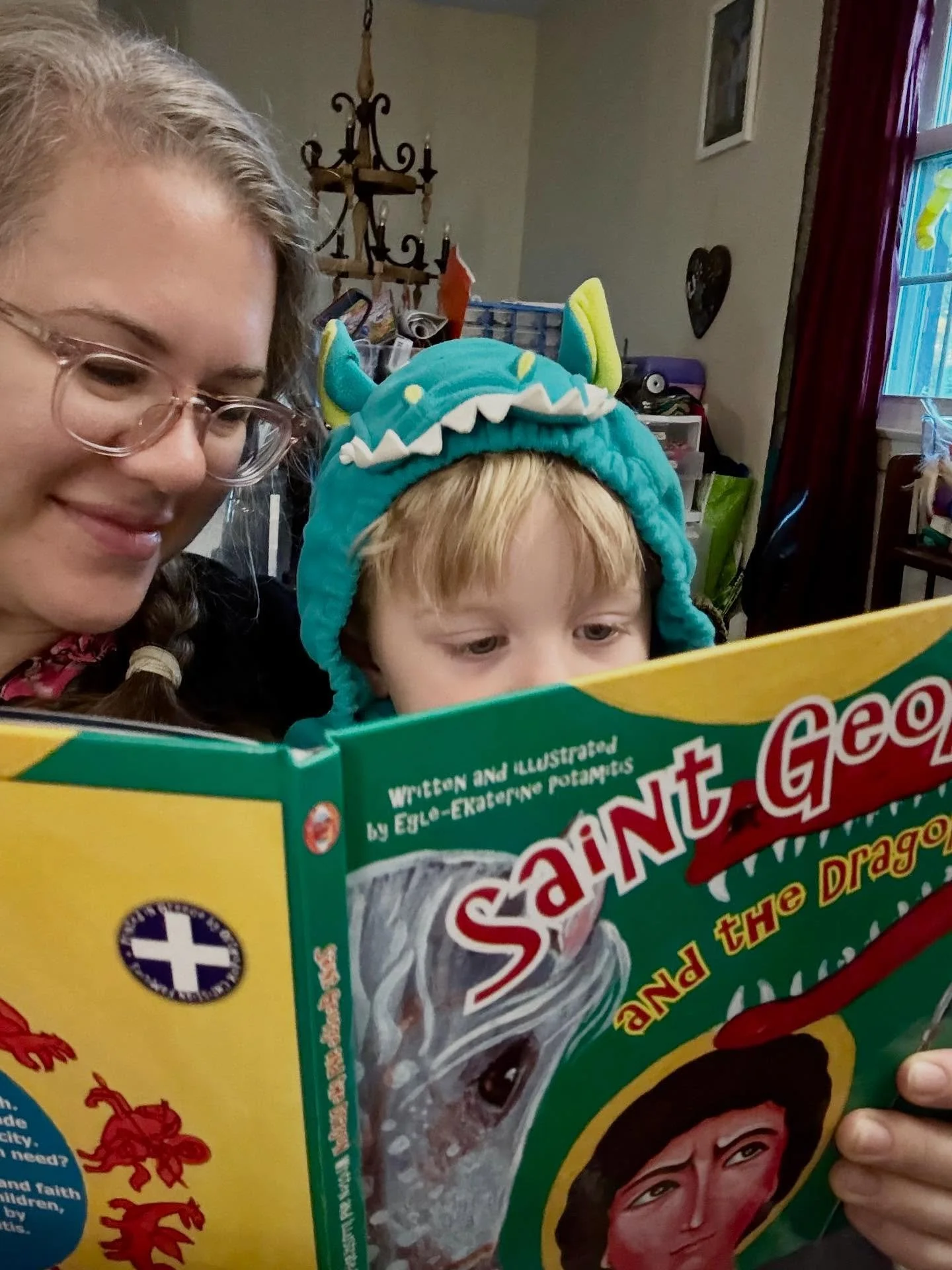 Pretty sure my son (in his dragon costume) is identifying with the wrong character in this book about St George and the dragon, but we have been reading it *on repeat* since it was gifted to him for his nameday this weekend. 
We don&rsquo;t have the 