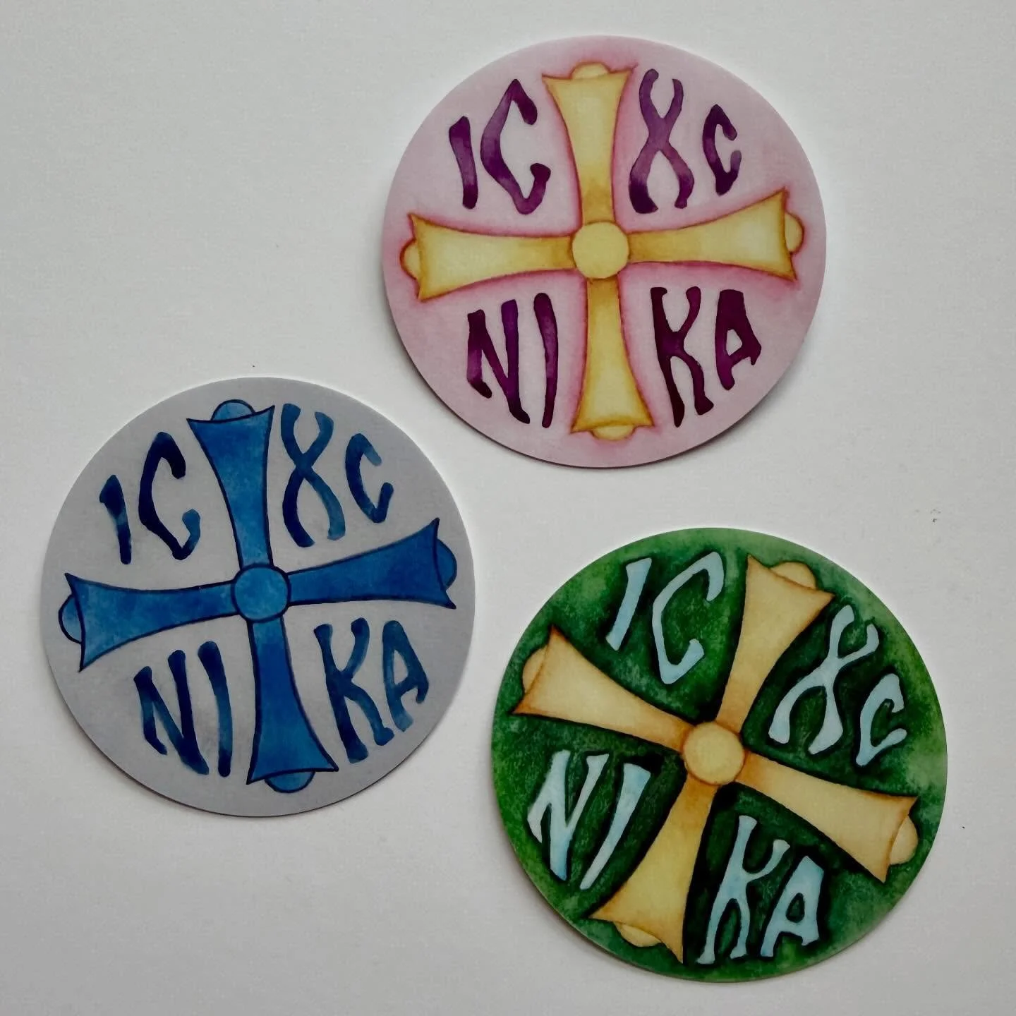 New stickers! This design is based on a cross in a church in Louisville. The pink is inspired by the colors of spring flowers. The green reminds me of the earth. And the blue is because I got some new blue paint and wanted to play around with it! The