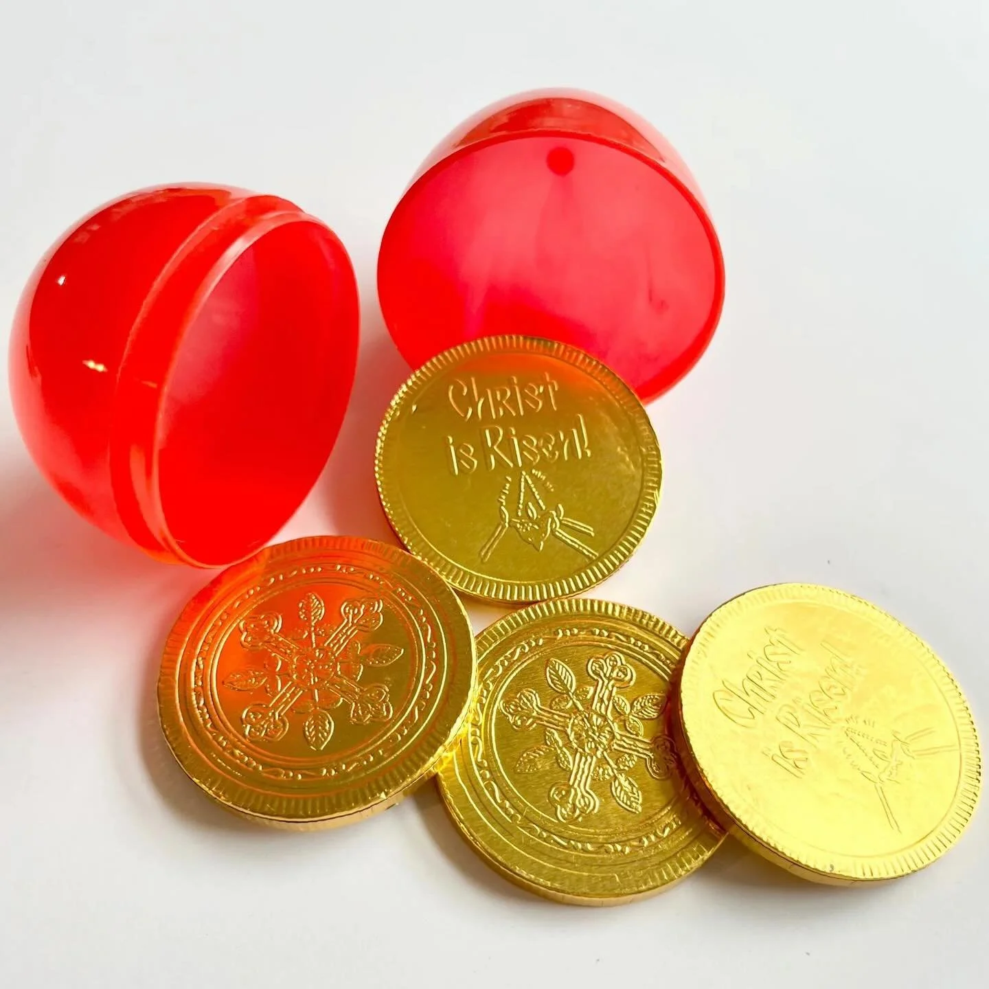 The cutest treat for Pascha baskets, and the chocolate coins (from @paideaclassics are *delicious*, top notch Belgian chocolate). 4 coins come in a red egg for less than $5! Find them in the Lent + Pascha Shop!