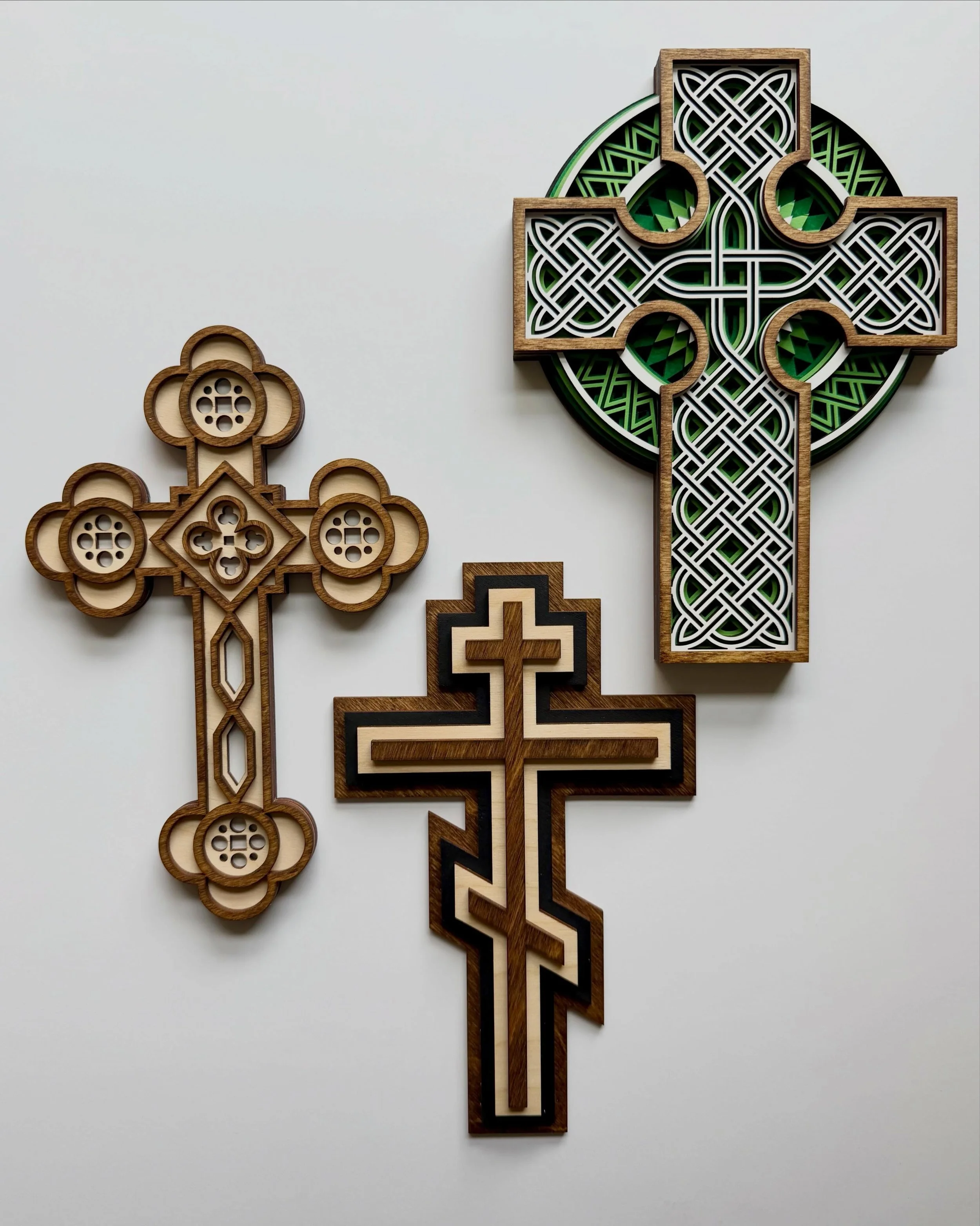 New!! These intricate layered wooden crosses from @gratefully.made are available in the Home + Prayer section of our website. They come with an adhesive hook which makes them easy peasy to hang, and they are designed and made with care by a talented 