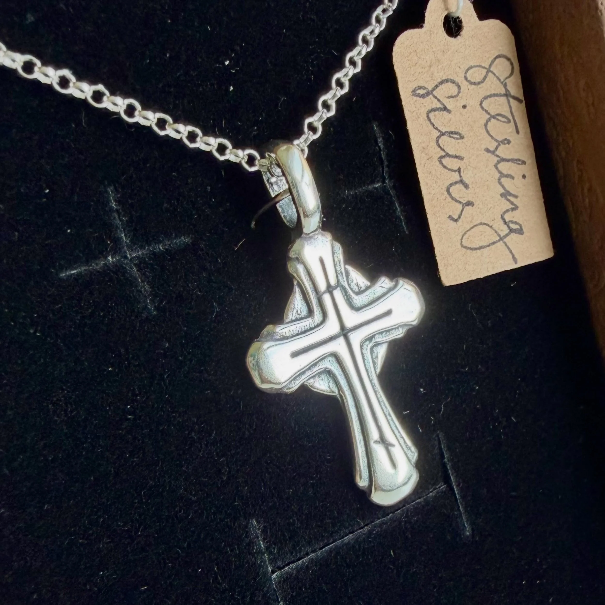 We added a new cross from Reader Philip this week! This faceted 3-bar cross is graceful and beautiful. Reader Philip is a 3rd generation gold and silver smith, and he hand makes each of these crosses using a mold he carved by hand. One of our favorit