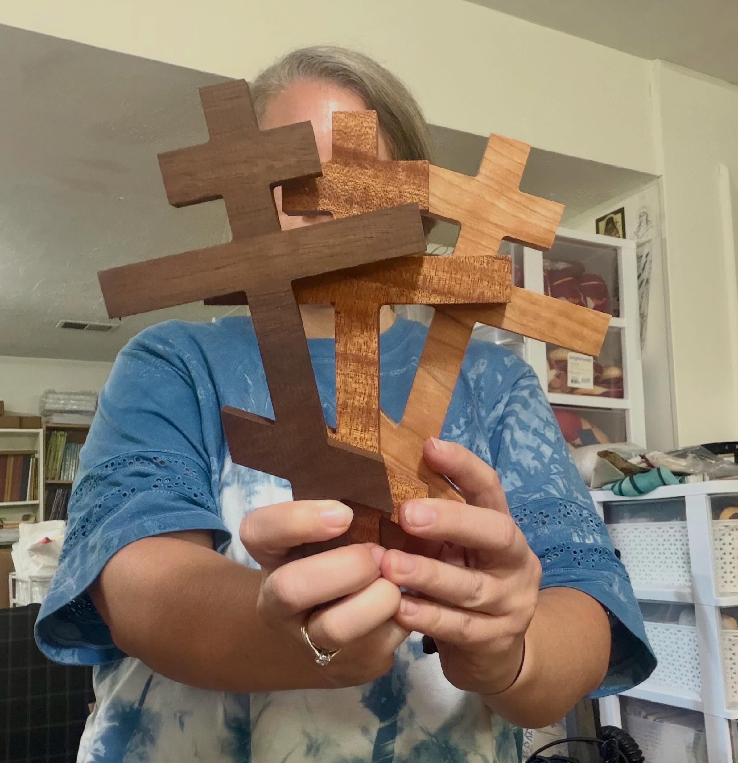 We restocked these 3 crosses yesterday&mdash; from left to right: Peruvian walnut, mahogany, and cherry. They&rsquo;re sold wood 3-bar crosses with a hole drilled in the back so they are ready to hang! A woodworker in CO (the same one who made those 