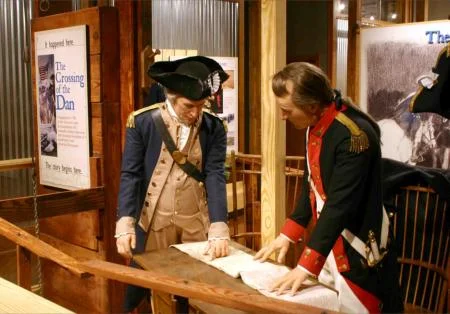 The Crossing of the Dan exhibit opens much like the beginning of the Southern Campaign of the American War for Independence. In the opening scene, General Nathanael Greene instructs his Quartermaster, Lt. Col. Edward Carrington, to explore the Dan and Yadkin Rivers to find an efficient route for transporting supplies to his army in North Carolina. Little did they know that this fateful decision would later save the American war efforts.