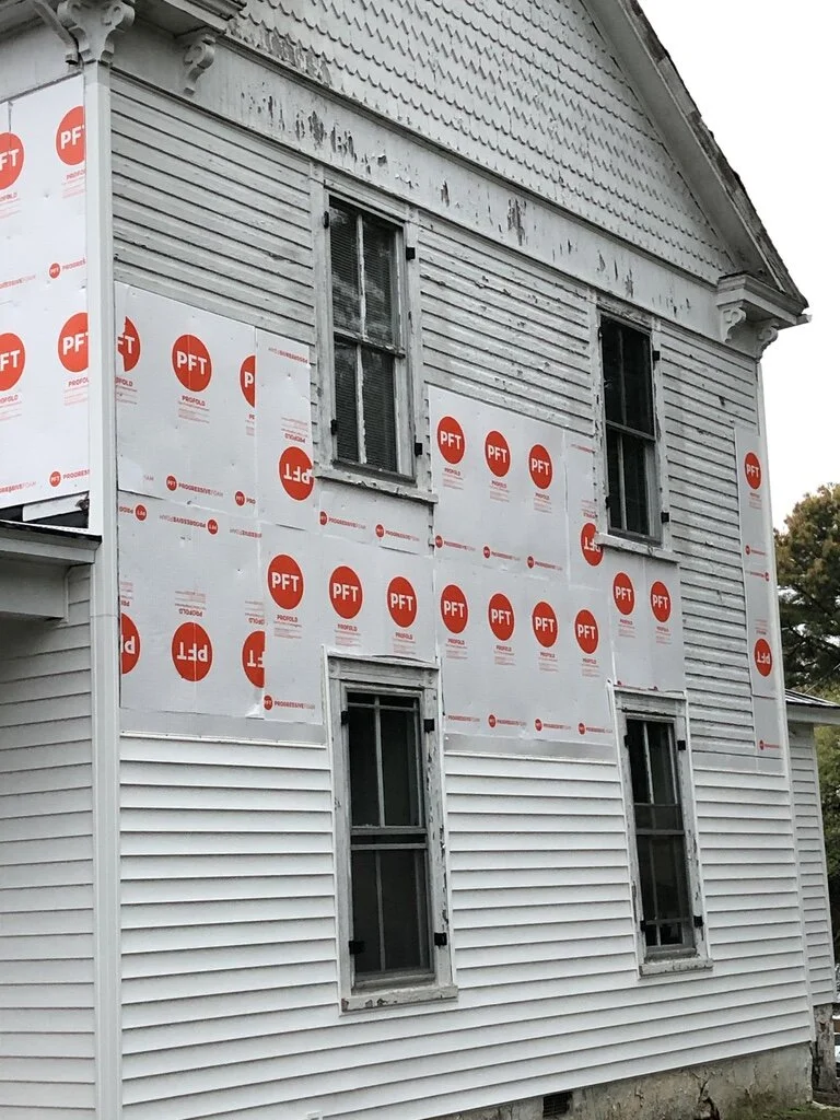 Siding is now being replaced, to be followed by scraping and repainting the cornices, decorative brackets and fish-scale shingles on the front and side pediments.