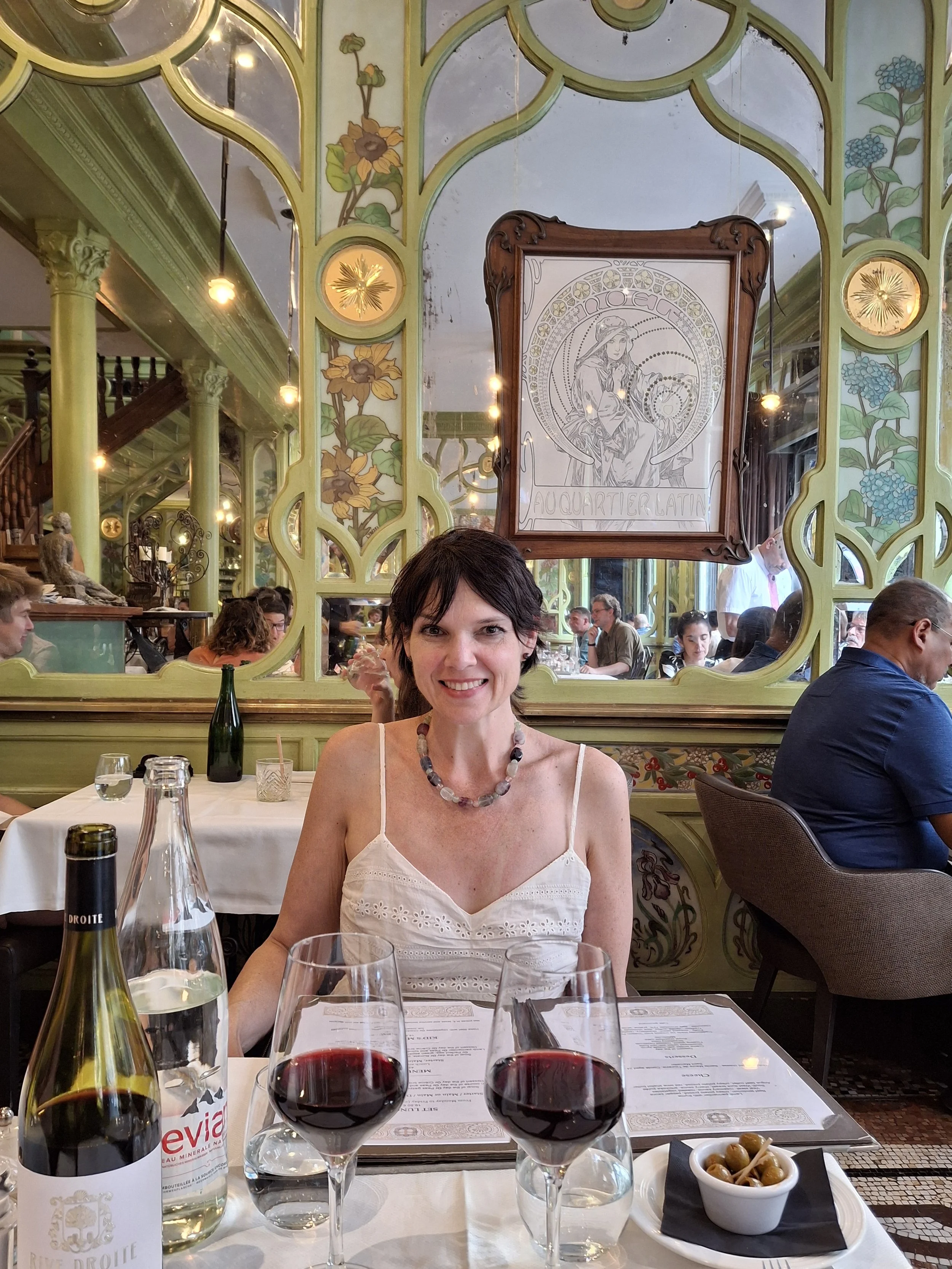 Evelyn Wilwerding at the Bar Racine in Paris, France.  Art Nouveau restaurant with original woodwork and art.
