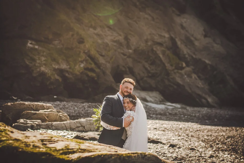 married-couple-hug-on-the-beach-devon.jpg