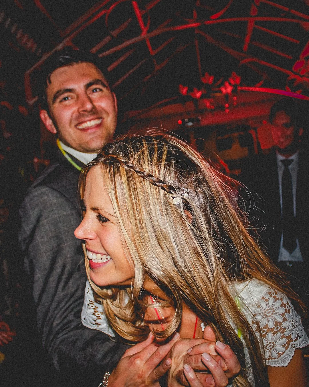bride and groom smiling and holding hands on the dancefloor - Tavistock - devon wedding.jpg