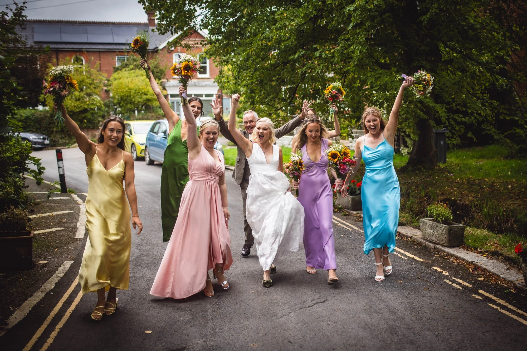 Girl-crew-bridal-party-walk-down-street-Exeter.jpg