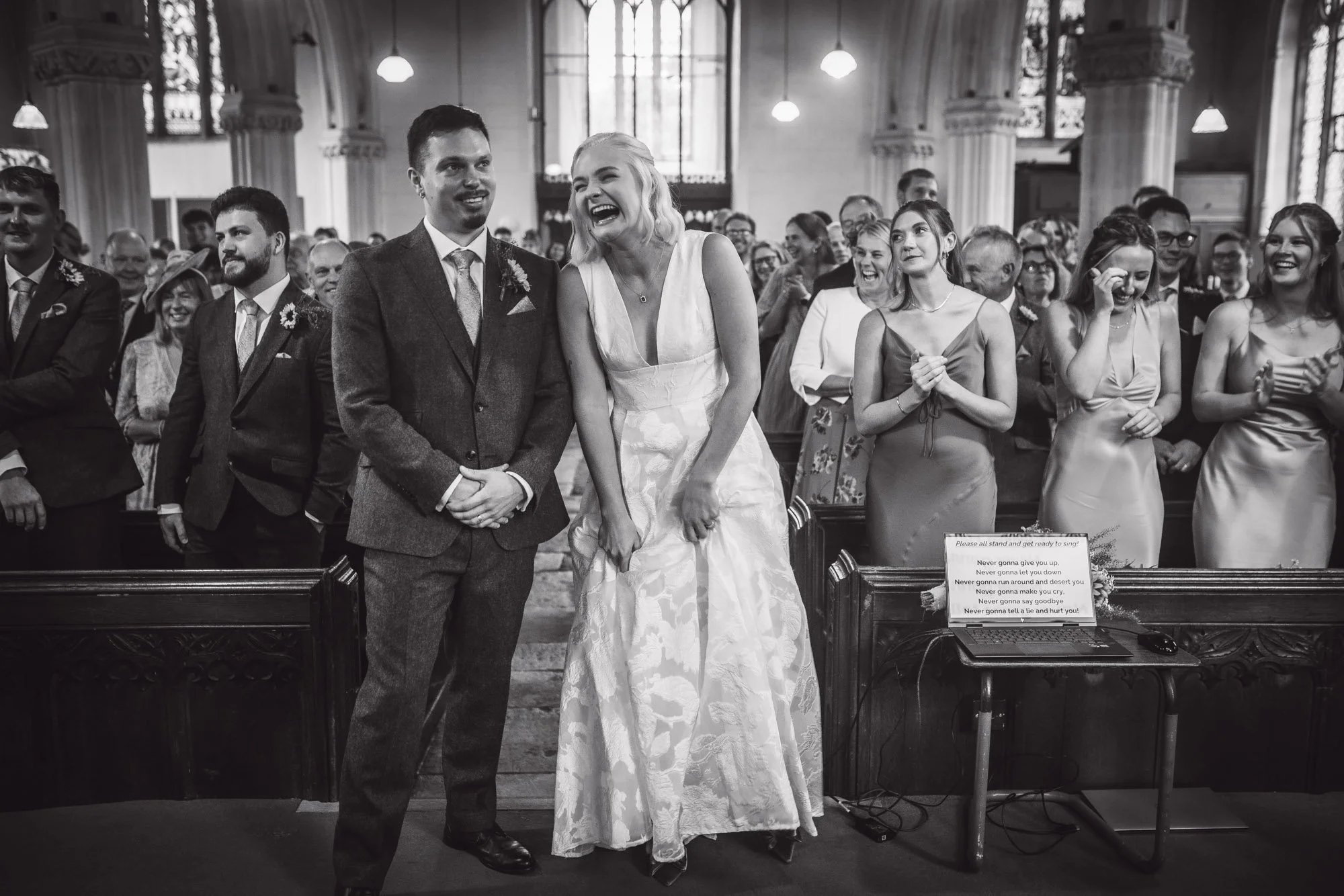 bride-laughing-at-Whimple-church-wedding-Devon.jpg