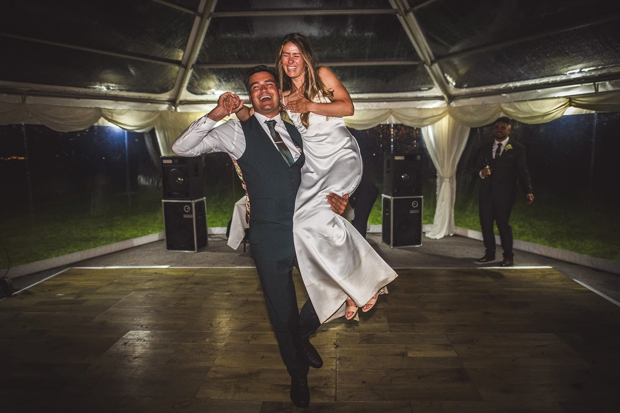 groom-lifts-bride-in-the-air-Scoriton-Devon.jpg