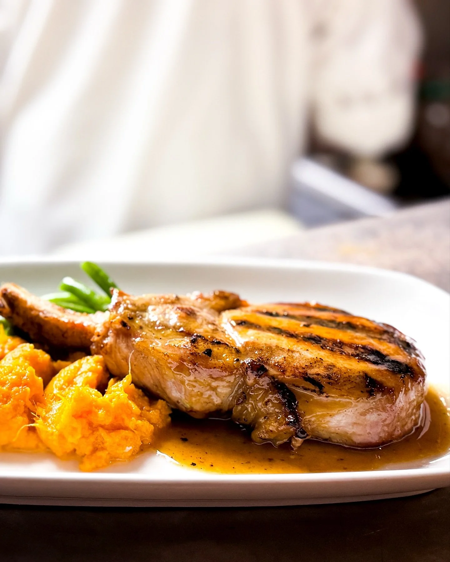 Achieving the perfect sear 🔥
 Our grilled marinated pork chop with apple cider mustard glaze, sweet potato mash, and green beans made its appearance as a dinner special last night. A fall favorite done right.
. . . #UpperEastSide #FallFlavors #PorkC