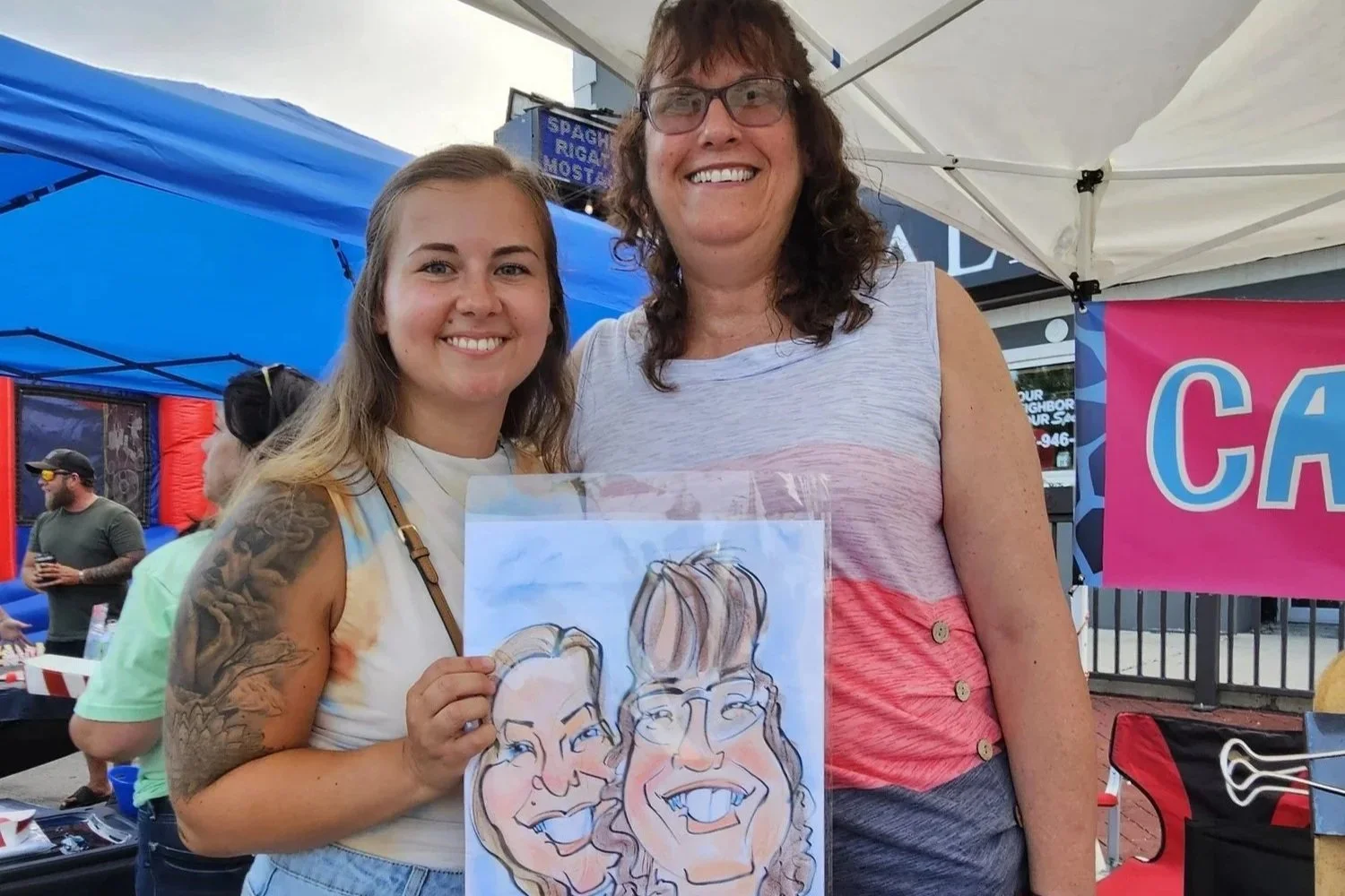 A circular logo with the text 'Manteno Oktoberfest' and 'Lighted Parade'. It features a cartoon family in a retro vehicle, holding a beer mug, with an American flag and Oktoberfest elements like pretzels and a church in the background.
