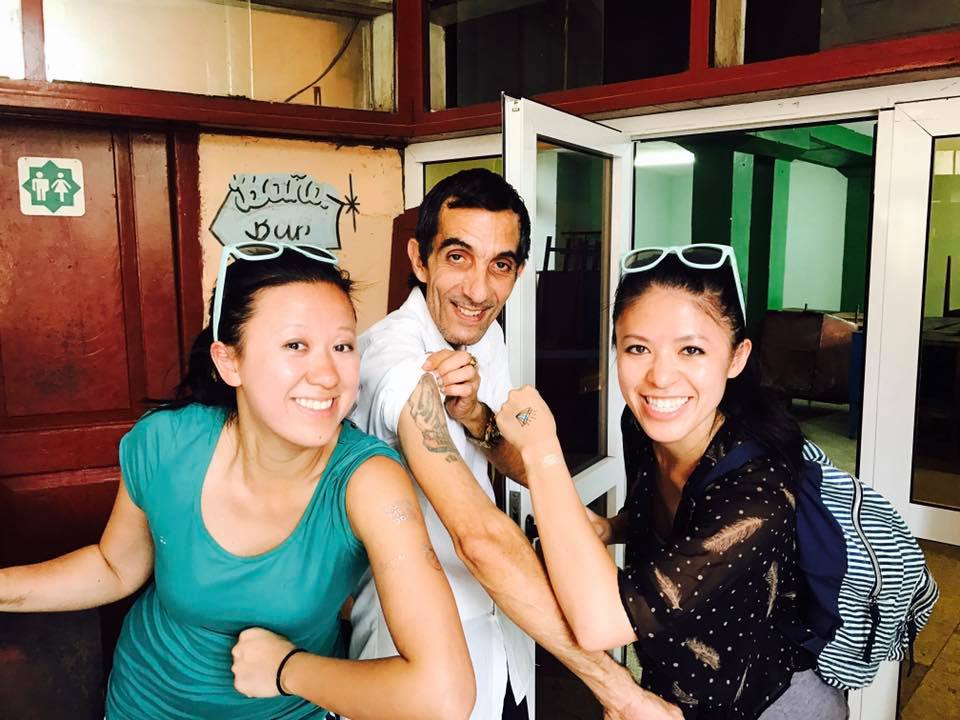 Cultural exchange through tat and rum appreciation.
