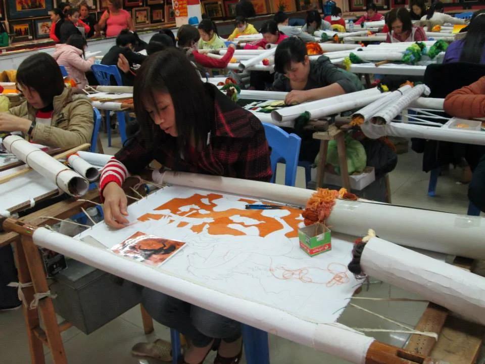 Embroiderers at the craft factory