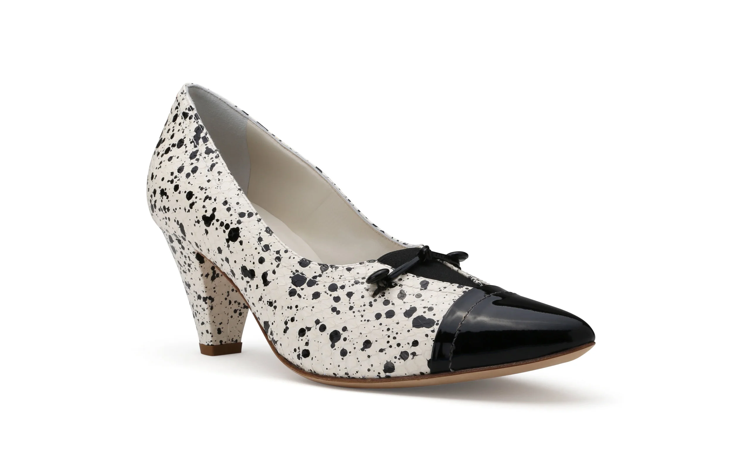 Beverly black white speckled leather pump front angle black patent cap toe bow detail
