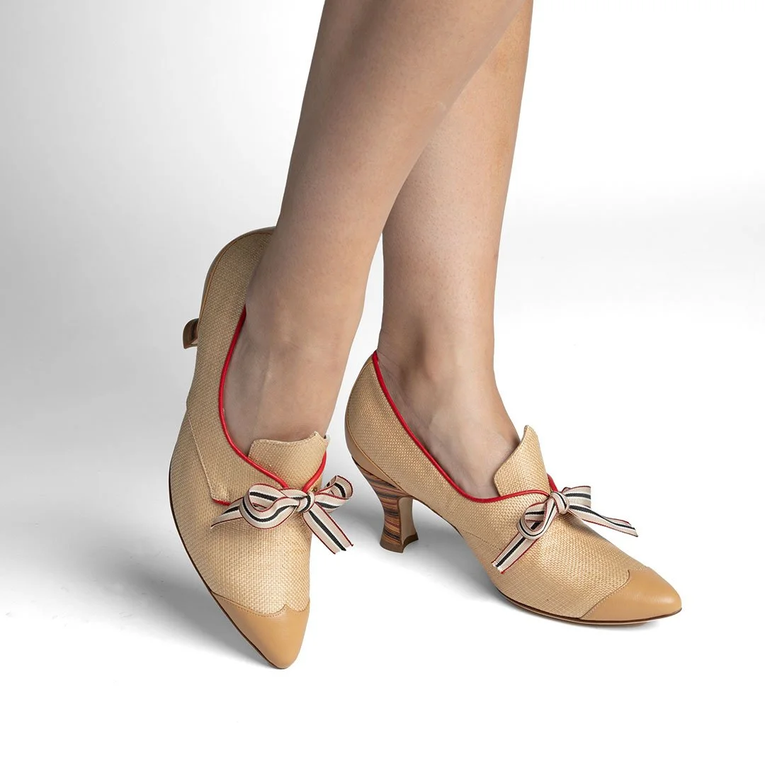 asey camel raffia luxury pump worn front view striped bow polychrome stacked leather heel