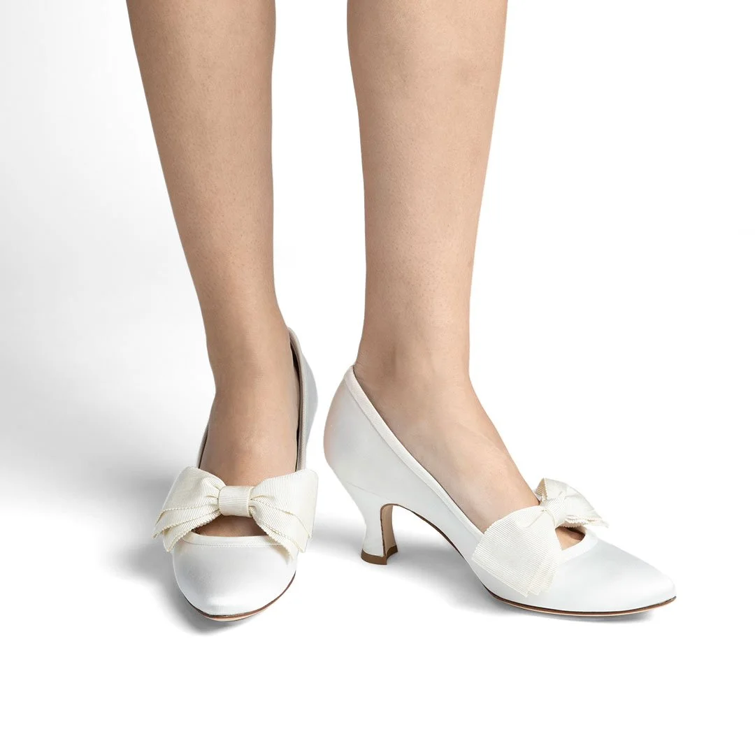 Kim white silk satin bridal pump worn front view grosgrain bow wedding heel