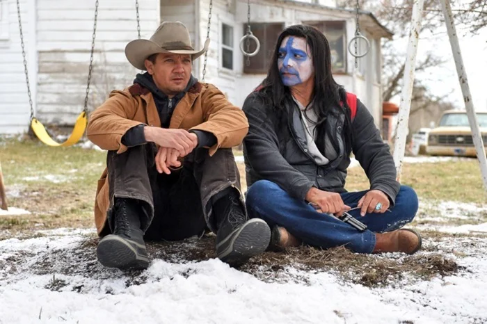 Jeremy Renner and Gil Birmingham in WIND RIVER (2017).
