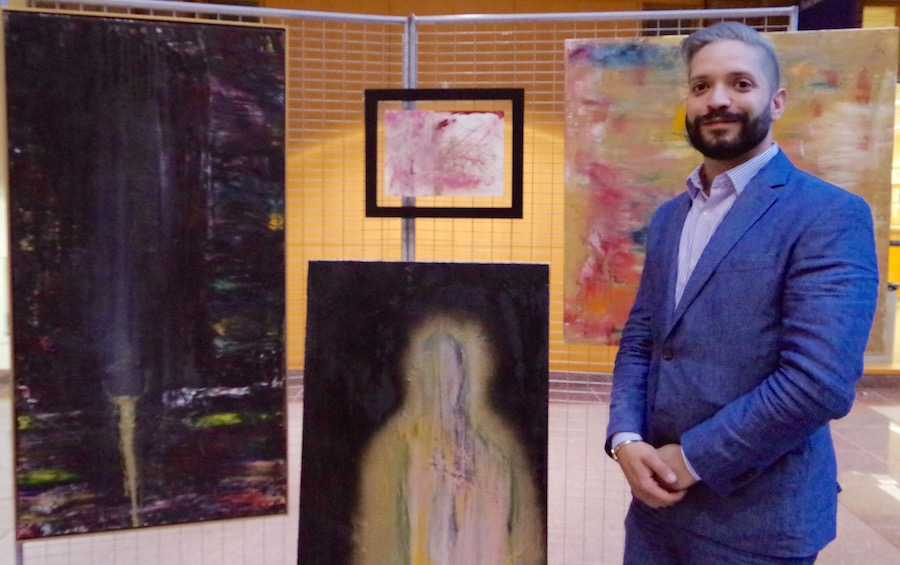 Jonathan Joseph Ganjian with his work. 