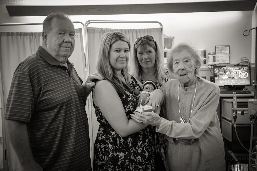Ashley Brandl with her family and Zane in the NICU. JoAnn Marrero photo. 