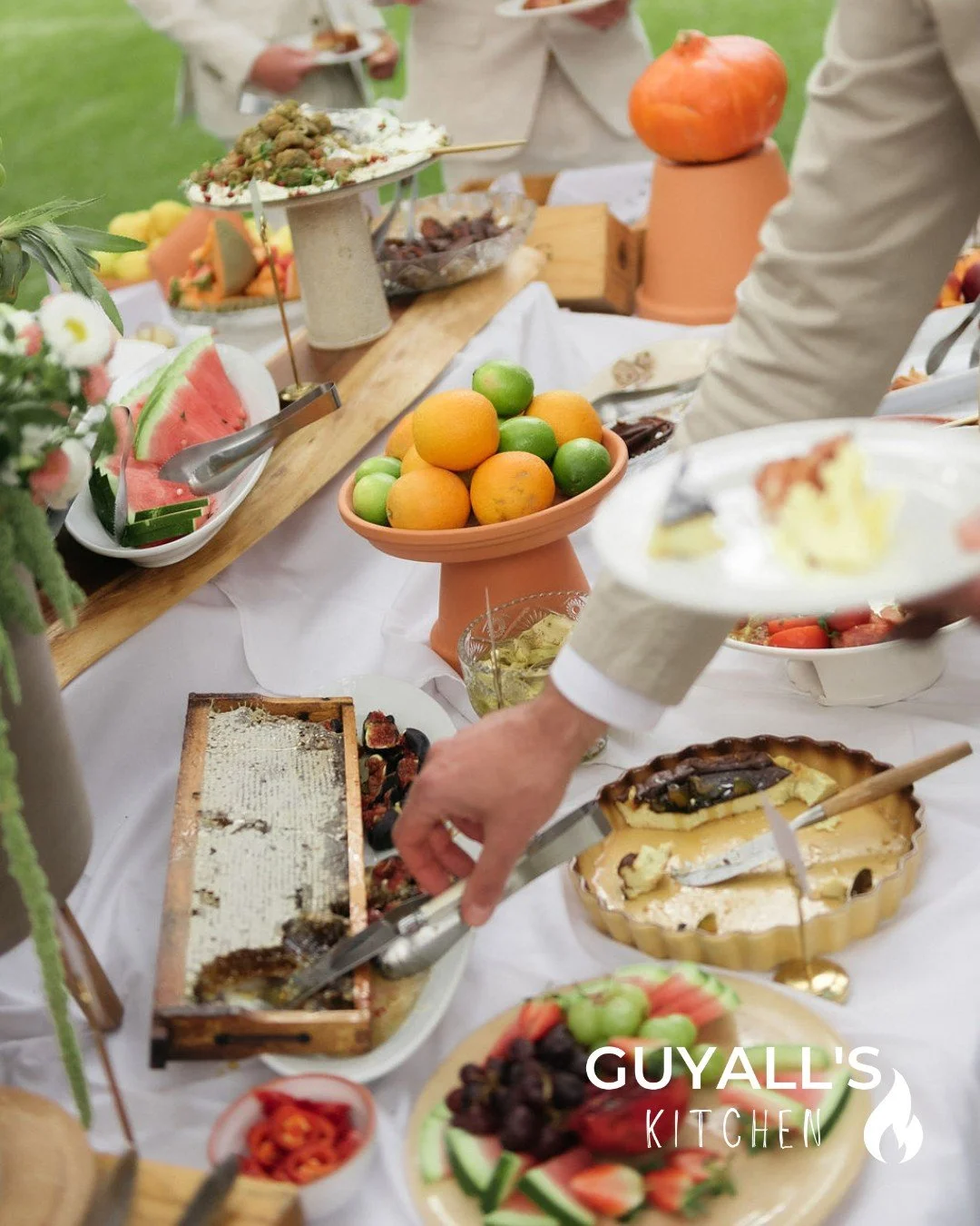 This is exactly how we love guests to eat 🍉✨ Big harvest tables, hands reaching in, and everyone going back for a little more.
.
.
#guyallskitchen #weddingfeast #harvesttable #weddingfood #foodiewedding
