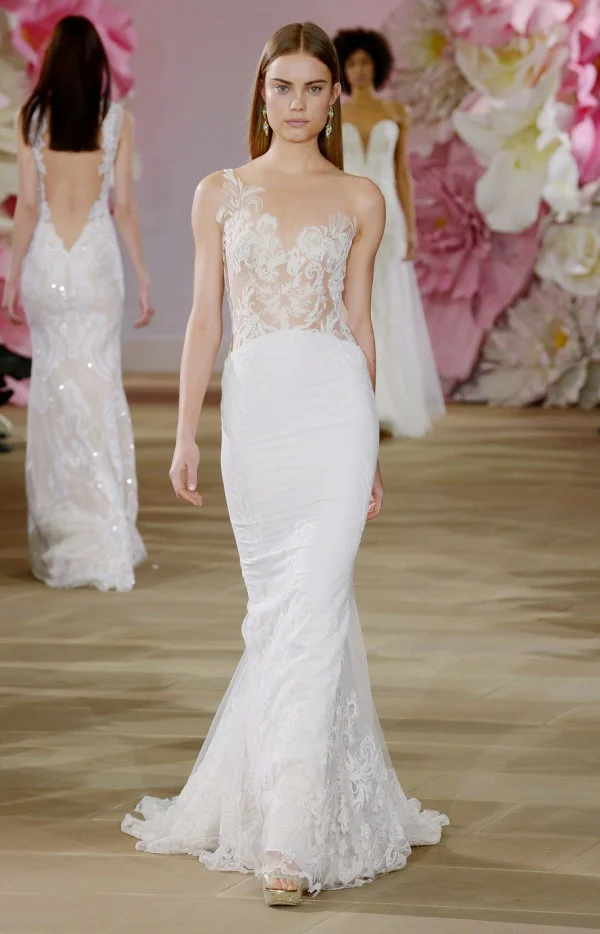 Illusion bodice with sheer backline. Detailed hem with cathedral train by Ines Di Santo. 